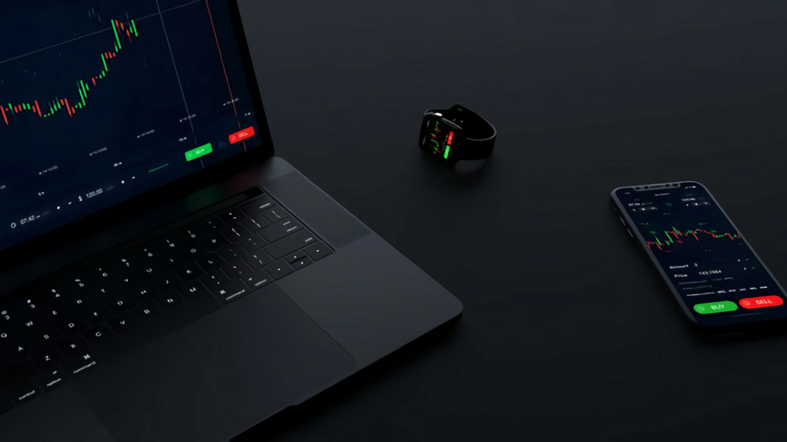Laptop and phone displaying crypto trading charts